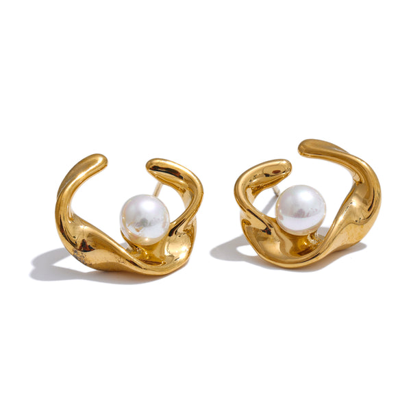 Gold hoop earrings with pearl centers on a white background